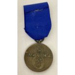A WWII style SS 8 year service medal on a blue ribbon.