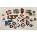 A collection of Red Cross badges and medal together with enamelled nursing badges.