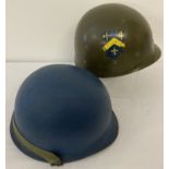 A US M1 steel helmet, rear seam, painted blue (for US Navy), liner has transfer decals to each side.