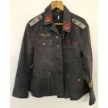 A German WWII style Luftwaffe flak artillery tunic with Africa cuff title.