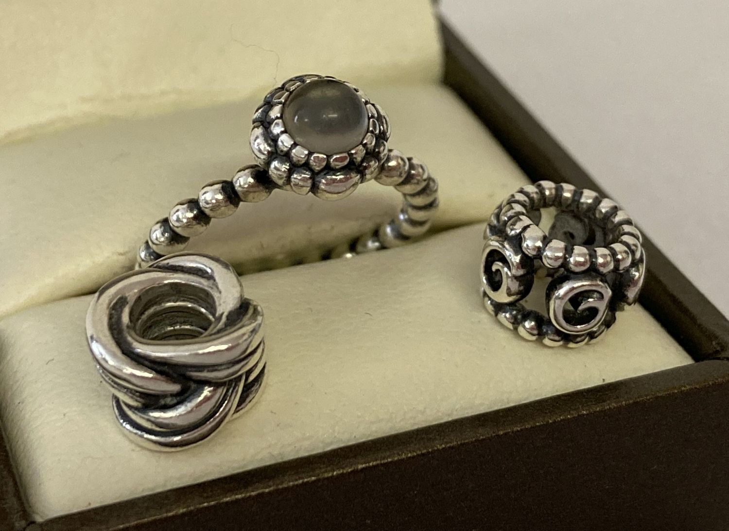 A Pandora birthstone "June" ring set with pale grey stone. Marked S925 ALE 48.