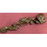 A highly carved wooden Chinese Ruyi sceptre.