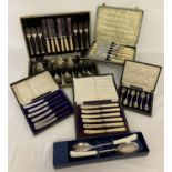 A quantity of vintage boxed cutlery sets to include butter knives, fish set and salad servers.