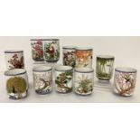 A collection of 11 Franklin Mint ceramic Japanese tea cups.