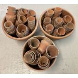 A collection of 100+ vintage terracotta plant pots in varying sizes and conditions.