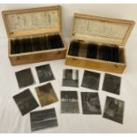 2 wooden boxes containing a quantity of assorted vintage photographic negative glass plates.