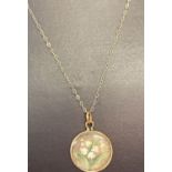 A 9ct gold fine belcher chain with a hand painted lily of the valley glass pendant.