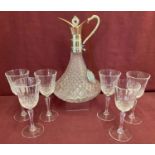 A vintage glass and silver plated claret jug together with a set of 6 stemmed glasses.