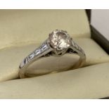 A vintage 9ct gold solitaire dress ring set with a central round cut clear stone.