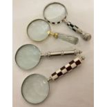 A collection of 4 large magnifying glasses.