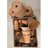 A collection of vintage and modern terracotta flower/plant pots in varying conditions and sizes.