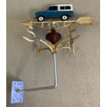 A painted cast metal weather vane with Land Rover detail finial.