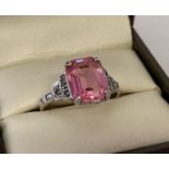 An Art Deco style 9ct gold and silver dress ring, set with square cut pale pink stone & marcasites.