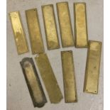 9 brass door finger plates; 5 with a matching rope design edging, 4 in varying styles.