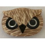 A Lea Stein style Lucite pin back brooch in the shape of an Owl's head.