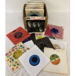 A collection of 89 vintage single records.