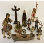 A collection of 15 resin figures of Native Indians and a totem pole in varying size