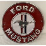 A Ford Mustang painted aluminium circular wall plaque.