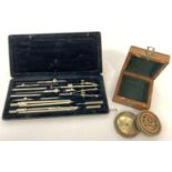 A boxed set of scientific instruments together with a boxed modern brass cased compass advertising