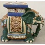 A ceramic jardinière/stool in the shape of an Asian elephant.