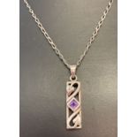 A silver curb chain with Rennie Mackintosh style drop pendant set with a square cut amethyst.