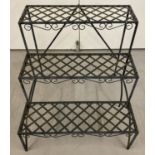 A modern metal 3 tier plant stand with lattice and scroll detail.