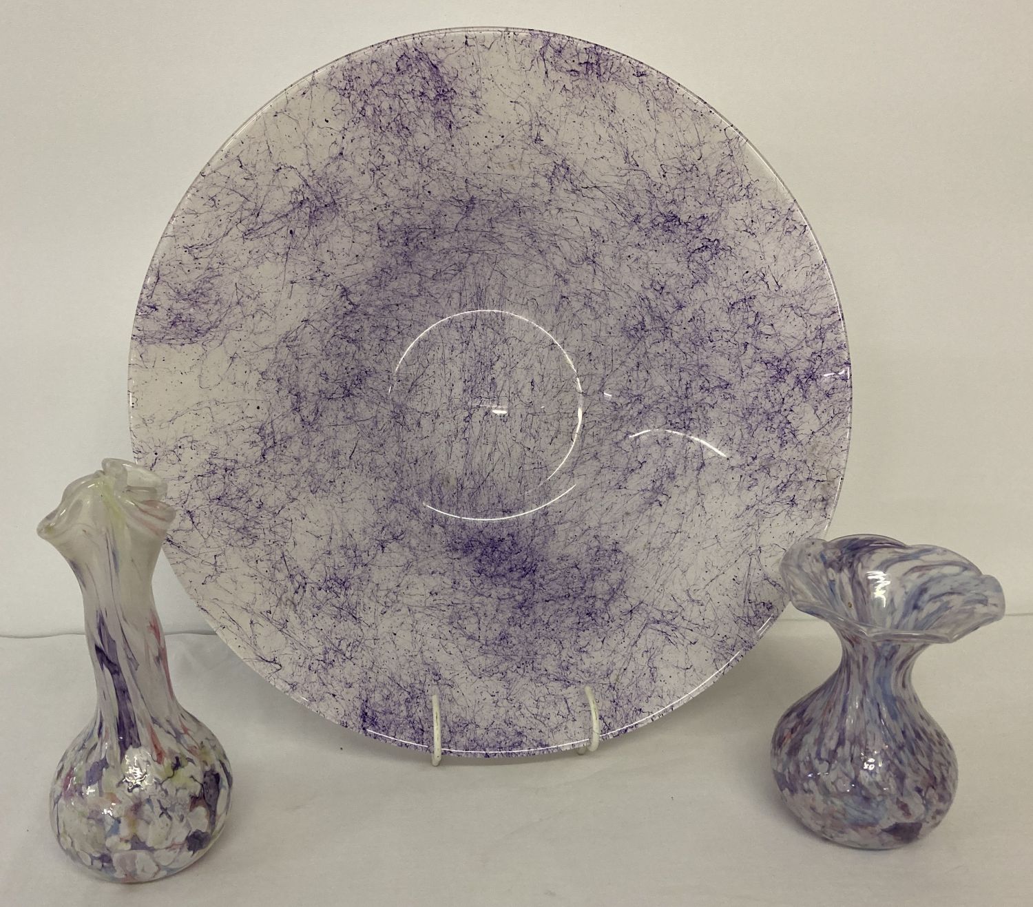 3 pieces of art glass. Comprising 2 iridescent vases of pastel tones & a large purple & white bowl.