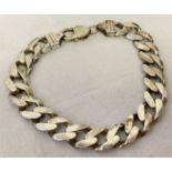 A heavy silver curb chain bracelet with lobster clasp. Total length approx. 8.5 inches.
