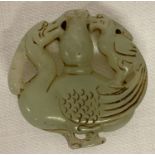 A Chinese Jade roundel depicting carved Phoenix detail to both sides.