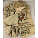 A collection of 8 hessian coffee bean sacks. In varying sizes.