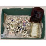 A collection of 100+ ceramic, metal wood and wicker collectors thimbles some in original packaging.