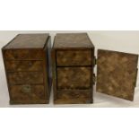 A pair of antique Japanese marquetry style miniature chests of drawers.
