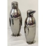 A pair of novelty penguin shaped cocktail shakers.