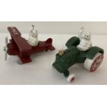 2 painted cast metal figures of Michelin men in vehicles.