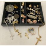 A small tray of mixed costume jewellery to include dress rings, necklaces and a rolled gold cross.