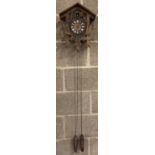 A vintage Black Forest wall hanging cuckoo clock with chains and weights, a/f.