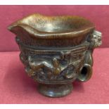 A carved Chinese libation cup with Mythical Creature detail and signature to base.