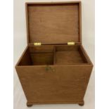 A vintage slope sided wooden box raised on 4 bun feet with sliding tray to interior.