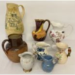 A collection of assorted vintage ceramic jugs.