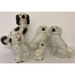 5 Staffordshire dog figures to include a pair and one with dalmatian decoration.