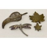 4 vintage and modern silver brooches.