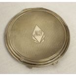 An Edwardian antique silver compact with engine turned decoration and initialled cartouche to front.