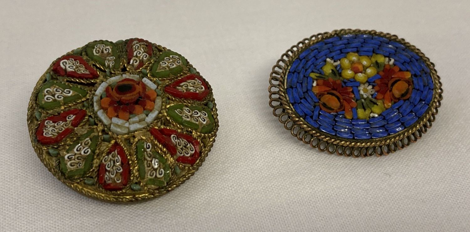 2 vintage micro mosaic brooches, one circular the other oval. Both with floral designs.