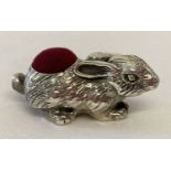 A small 925 silver pin cushion in the form of a rabbit, with red velvet cushion.
