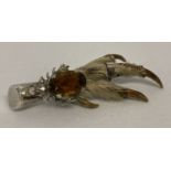 A Scottish silver birds foot brooch with stag decoration and set with an oval citrine.
