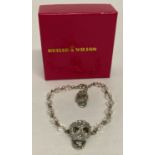 A boxed Butler & Wilson skull and glass bead bracelet.
