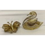 2 silver gilt filigree brooches in the shape of a swan and a butterfly.