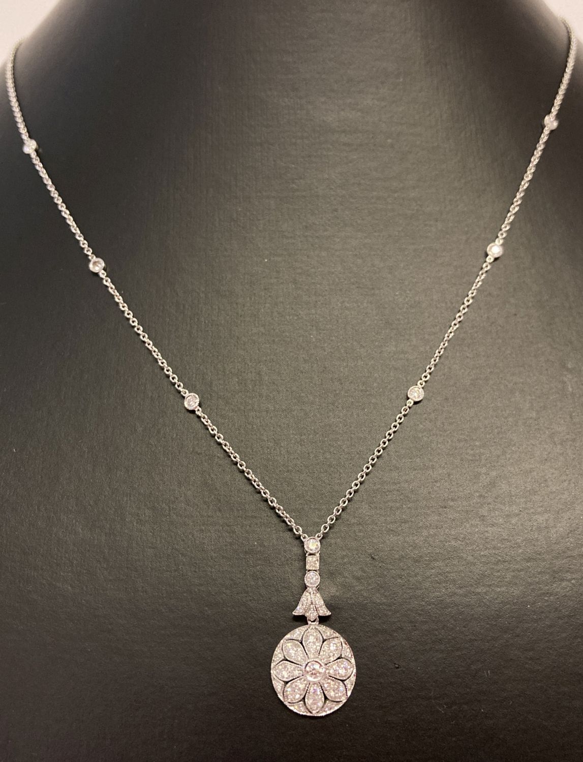 An 18ct white gold and diamond necklace by Luke Stockley, London.