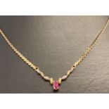 A 9ct gold pink sapphire and diamond necklace.