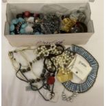 A box of modern costume jewellery to include necklaces and bracelets.